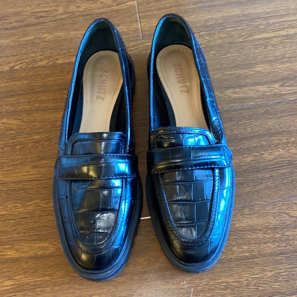 Black faux crocodile loafers.